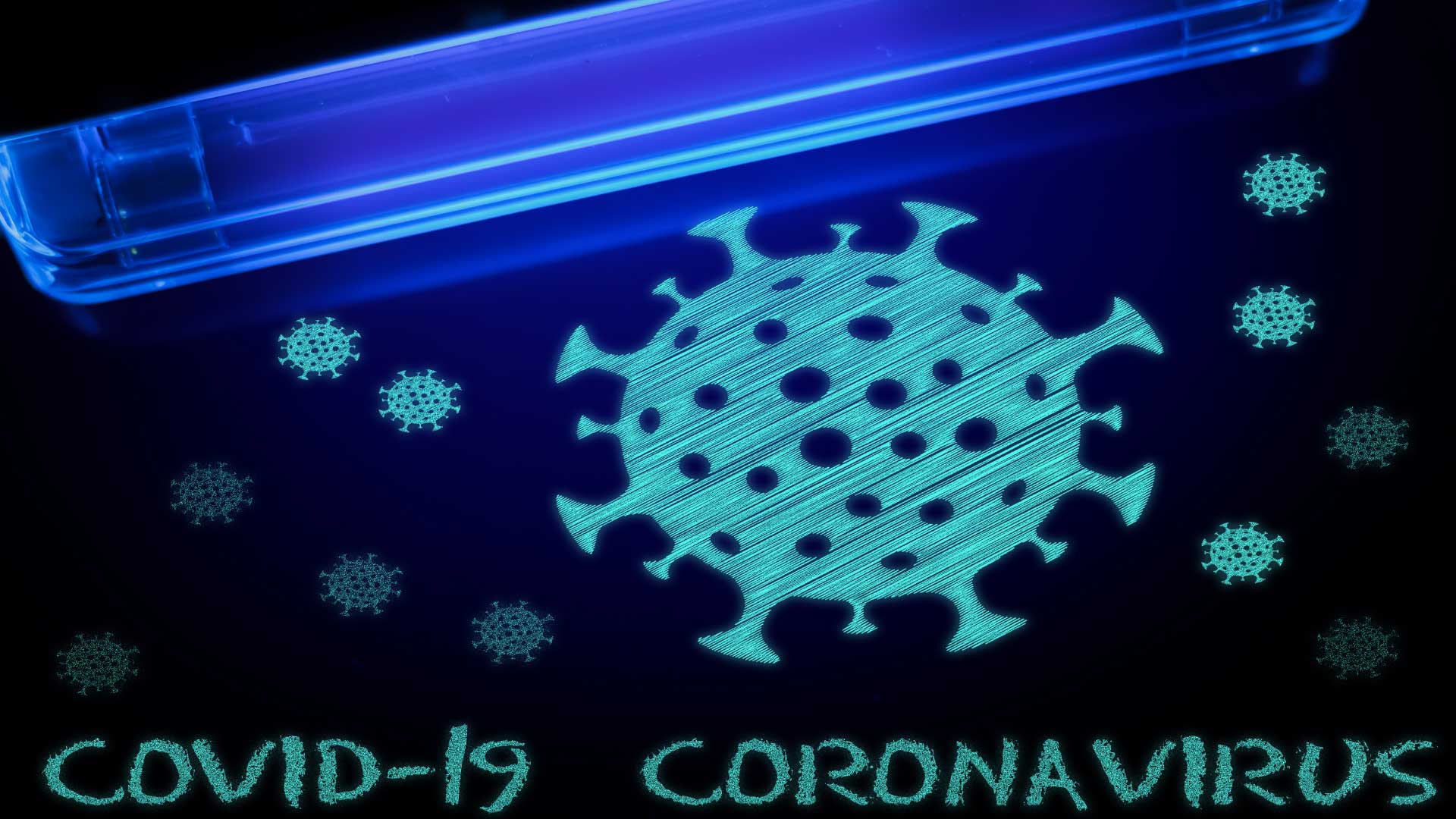 UV light shining on drawing of the COVID-19 virus
