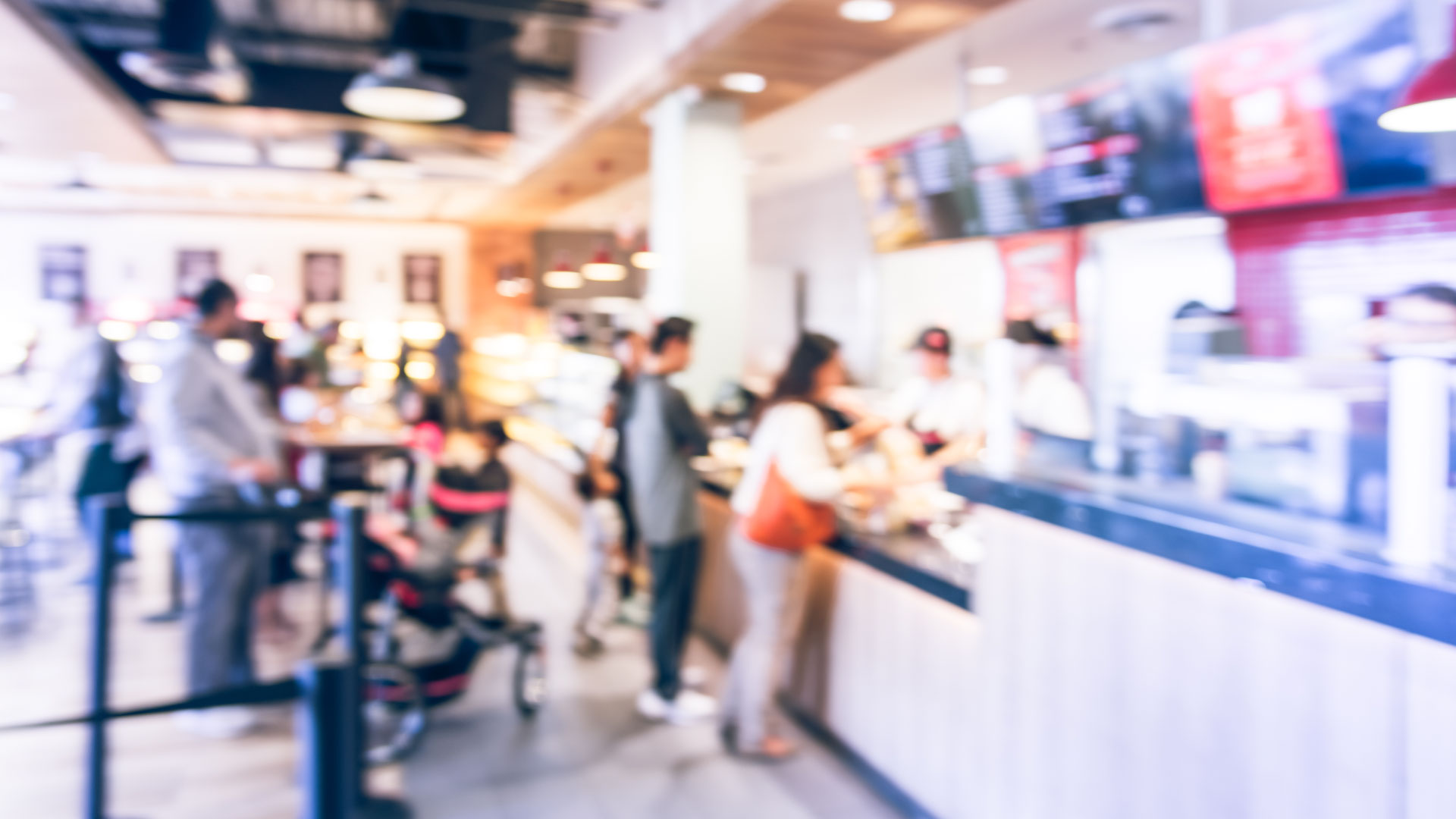 Blurred picture of people ordering food at quick serve restaurant