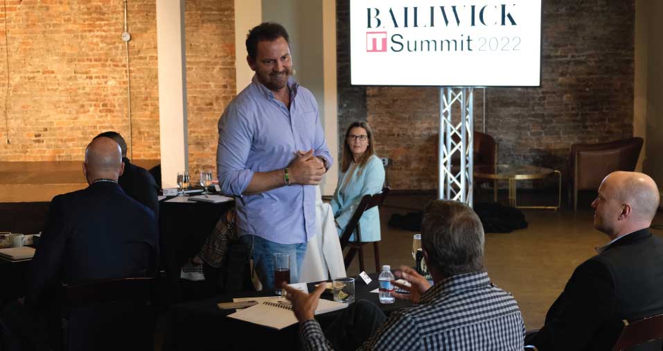 Jimmy Yeary speaking with audience members at the 2022 Bailiwick IT Summit.