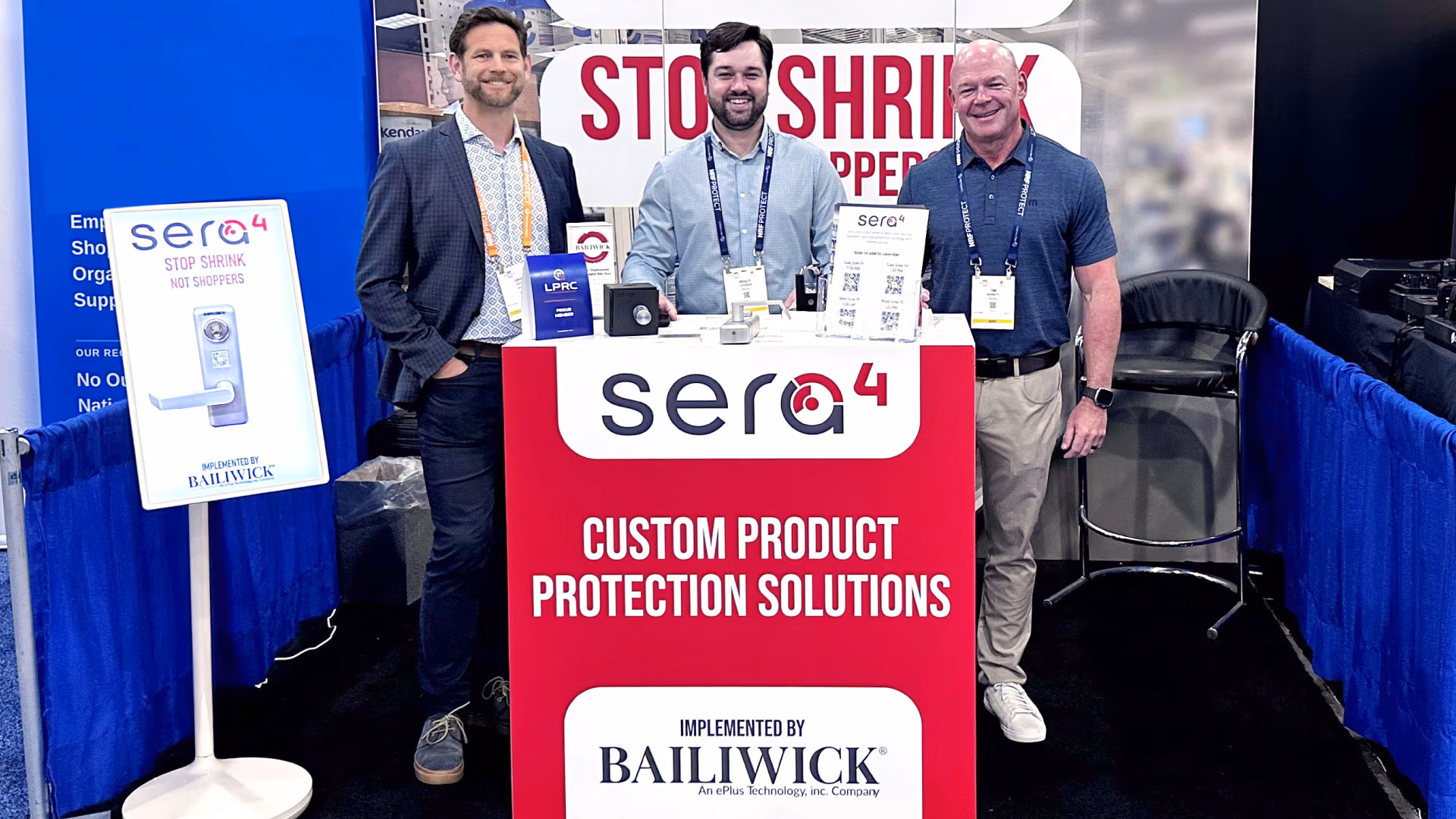 The Bailiwick and Sera4 team at NRF protect standing in a booth.