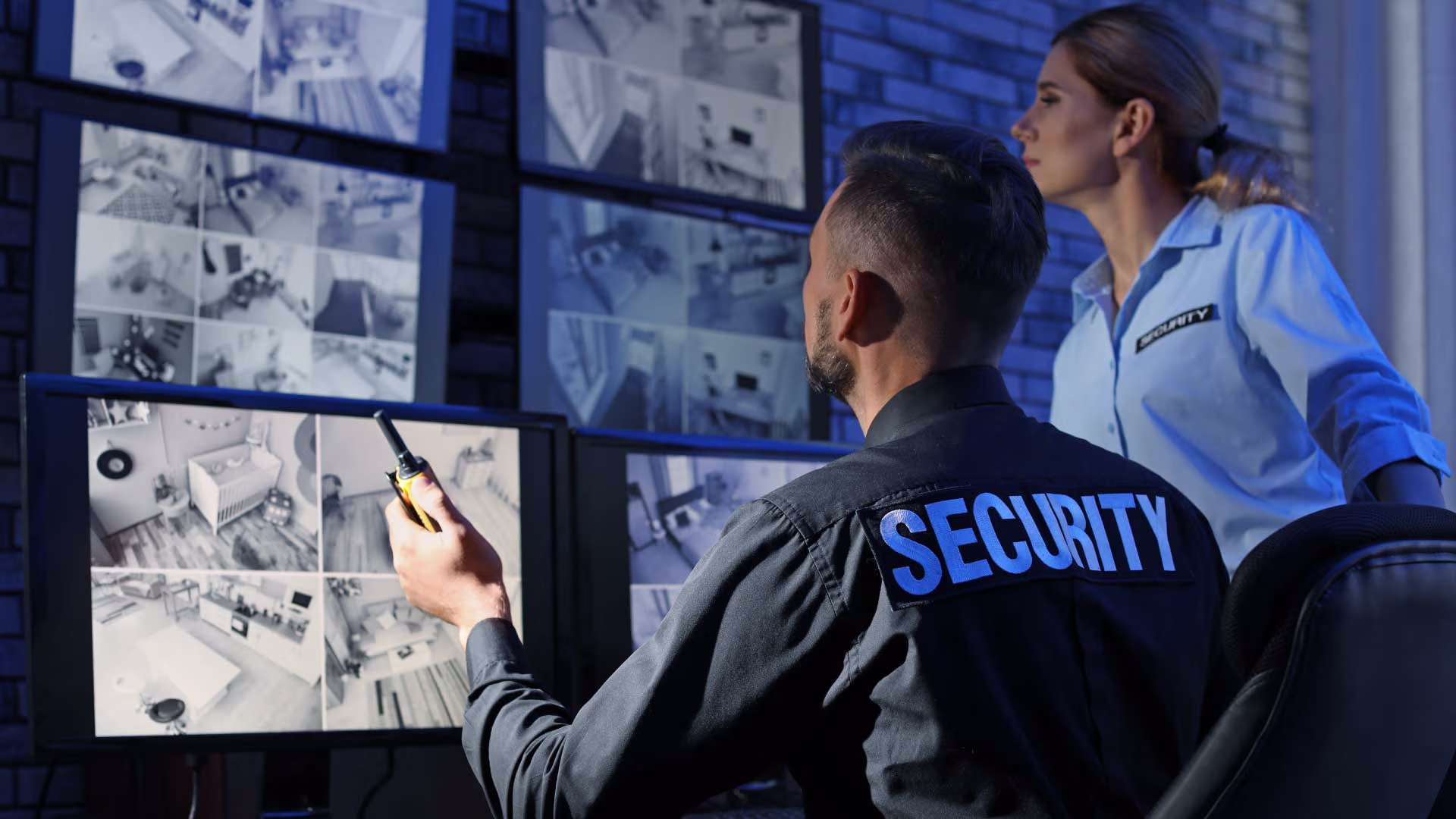 Security personnel reviewing CCTV feeds.