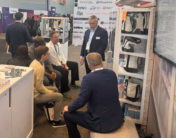A group of people sitting and listening to a person speak at a digital locks demonstration.